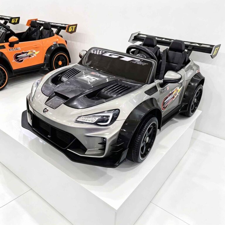 CA911 silver toy race car displayed on white platform