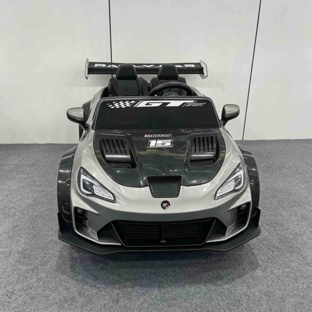CA911 silver toy racing car in showroom